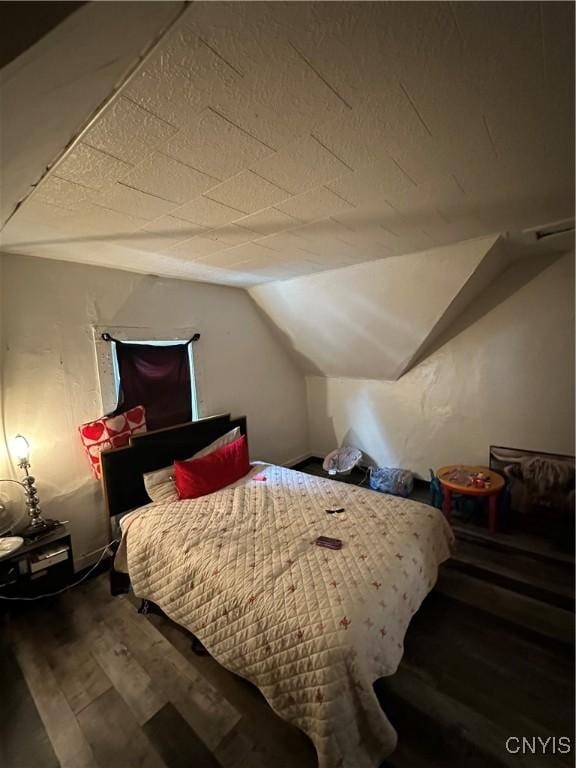 1417 Butternut St, Syracuse, NY 13208 - bedroom with vaulted ceiling and wood finished floors