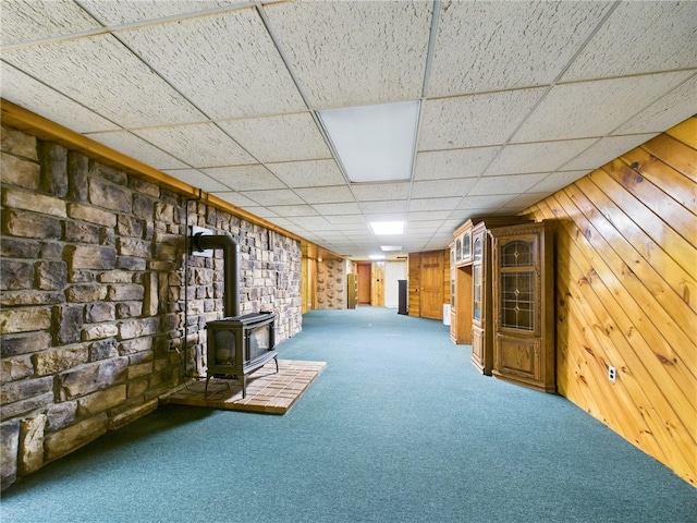 1041 Rte 44, Shinglehouse, PA 16748 - finished basement with a wood stove, carpet floors, a paneled ceiling, and wood walls
