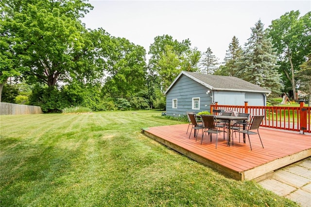 1948 Five Mile Line Rd, Penfield, NY 14526 - view of grassy yard featuring a wooden deck, outdoor dining area, and view of wooded area