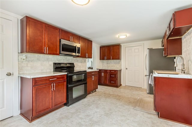 1948 Five Mile Line Rd, Penfield, NY 14526 - kitchen featuring double oven range, stainless steel microwave, dark brown cabinets, light countertops, and tasteful backsplash