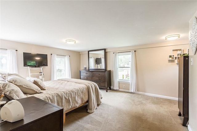1948 Five Mile Line Rd, Penfield, NY 14526 - bedroom with multiple windows and light carpet
