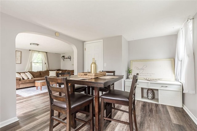 1948 Five Mile Line Rd, Penfield, NY 14526 - dining room with arched walkways and wood finished floors