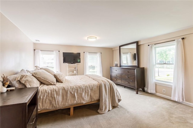 1948 Five Mile Line Rd, Penfield, NY 14526 - bedroom featuring multiple windows and light colored carpet