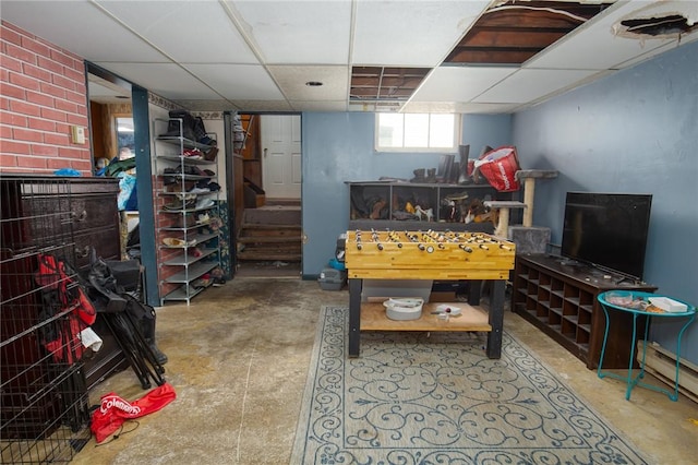 130 Stark Ave, Milo, NY 14527 - recreation room with concrete flooring, a drop ceiling, and a baseboard radiator