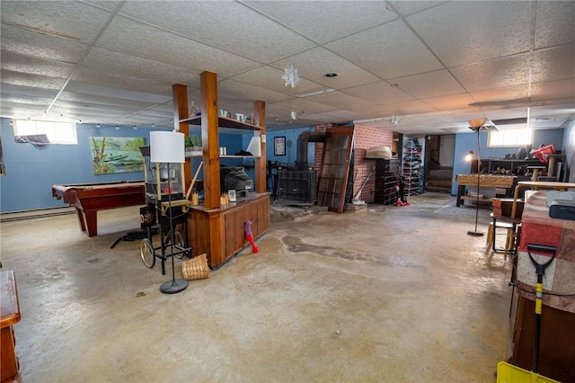 130 Stark Ave, Milo, NY 14527 - below grade area with a drop ceiling, billiards table, a baseboard heating unit, and a wood stove