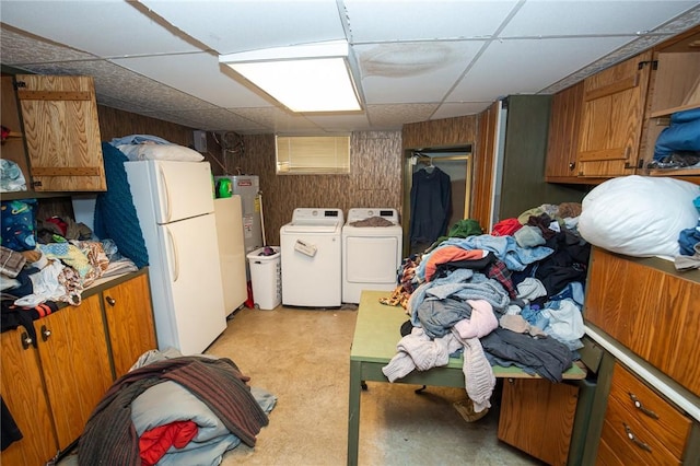 130 Stark Ave, Milo, NY 14527 - finished below grade area featuring washer and clothes dryer, freestanding refrigerator, a paneled ceiling, water heater, and wood walls