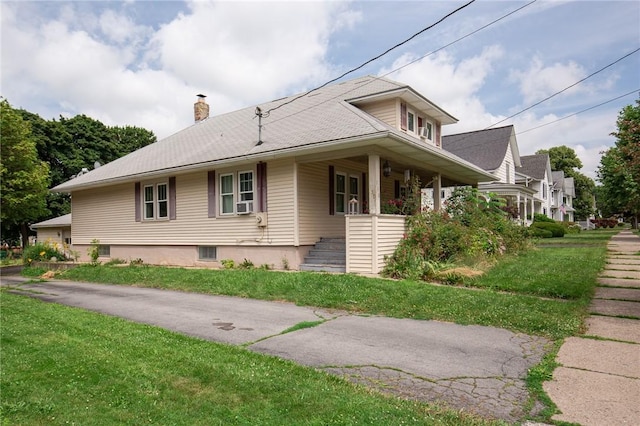 130 Stark Ave, Milo, NY 14527 - view of side of home with a chimney, a porch, a lawn, and stairway