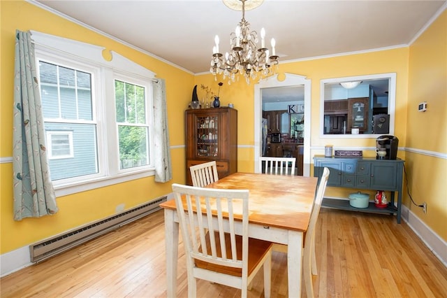 130 Stark Ave, Milo, NY 14527 - dining space with a baseboard radiator, a chandelier, light wood-style floors, and crown molding