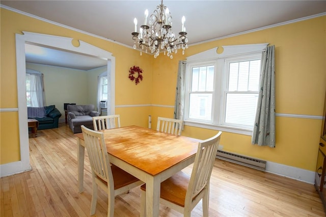 130 Stark Ave, Milo, NY 14527 - dining space featuring a baseboard heating unit, light wood-style flooring, a chandelier, and ornamental molding