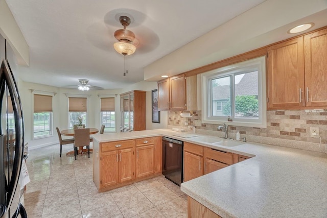 160 Cranbrook Ter, Webster, NY 14580 - kitchen featuring a peninsula, ceiling fan, black appliances, and plenty of natural light