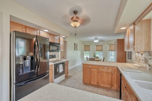 160 Cranbrook Ter, Webster, NY 14580 - kitchen with black appliances, ceiling fan, backsplash, light countertops, and recessed lighting