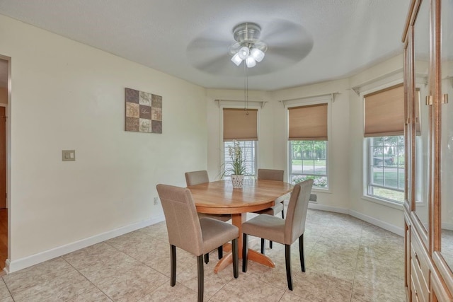 160 Cranbrook Ter, Webster, NY 14580 - dining space featuring healthy amount of natural light, a ceiling fan, and light tile patterned flooring
