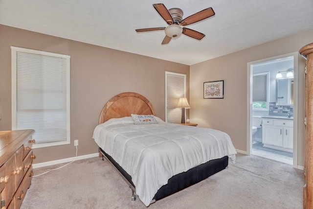 160 Cranbrook Ter, Webster, NY 14580 - bedroom with light colored carpet, ensuite bathroom, and ceiling fan