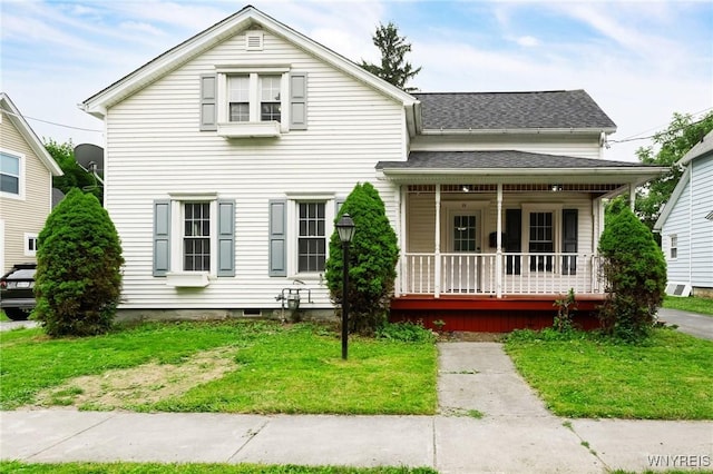 23 Lombardy St, Lancaster, NY 14086 - view of front facade with covered porch, a front lawn, and roof with shingles