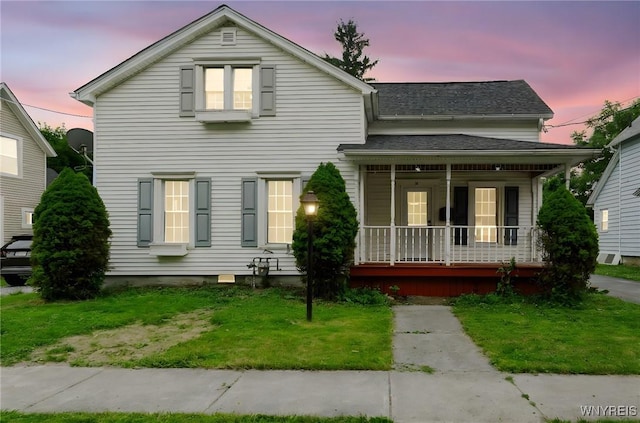 23 Lombardy St, Lancaster, NY 14086 - view of front facade featuring a porch and a yard