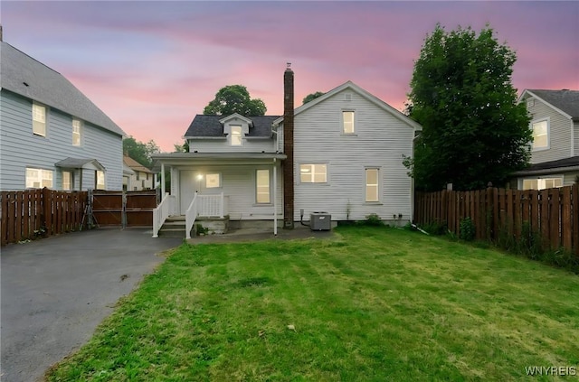 23 Lombardy St, Lancaster, NY 14086 - rear view of property featuring a chimney