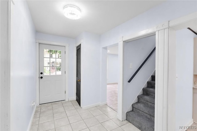 23 Lombardy St, Lancaster, NY 14086 - entryway with stairway and light tile patterned flooring
