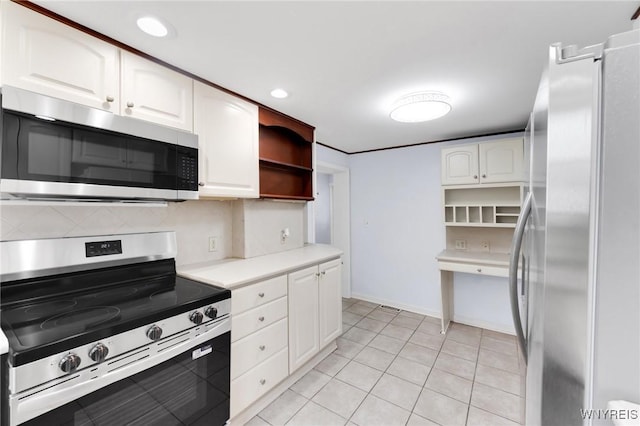 23 Lombardy St, Lancaster, NY 14086 - kitchen with appliances with stainless steel finishes, open shelves, light countertops, decorative backsplash, and recessed lighting