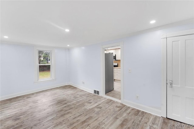 23 Lombardy St, Lancaster, NY 14086 - empty room with light wood-style flooring and recessed lighting