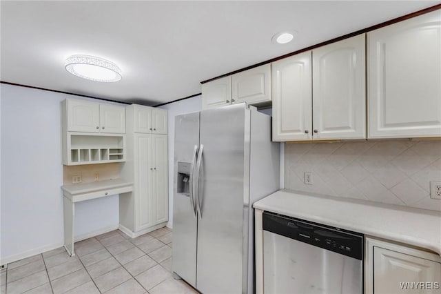 23 Lombardy St, Lancaster, NY 14086 - kitchen with appliances with stainless steel finishes, white cabinets, light tile patterned floors, and decorative backsplash