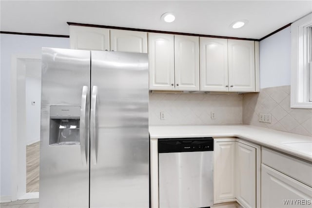 23 Lombardy St, Lancaster, NY 14086 - kitchen with appliances with stainless steel finishes, white cabinets, decorative backsplash, light countertops, and recessed lighting
