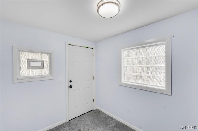 23 Lombardy St, Lancaster, NY 14086 - foyer entrance with carpet and baseboards