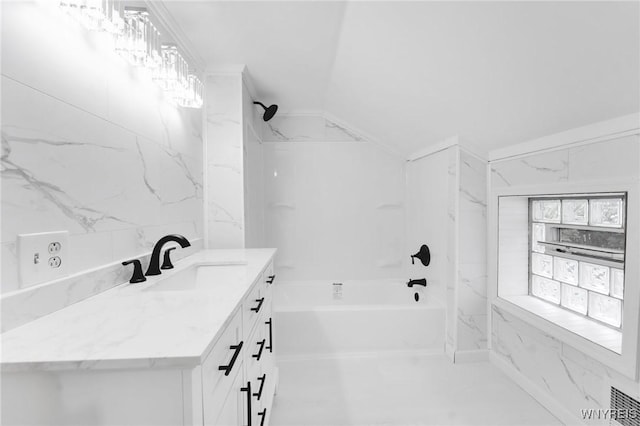 23 Lombardy St, Lancaster, NY 14086 - bathroom with vanity,  shower combination, and vaulted ceiling