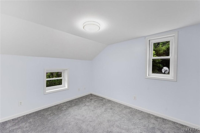 23 Lombardy St, Lancaster, NY 14086 - additional living space with carpet flooring and vaulted ceiling
