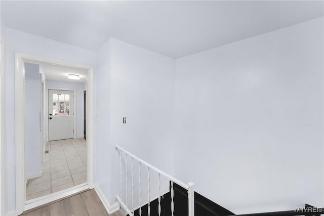 23 Lombardy St, Lancaster, NY 14086 - hall featuring an upstairs landing and wood finished floors