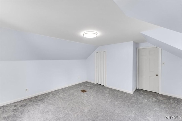 23 Lombardy St, Lancaster, NY 14086 - additional living space with carpet floors and lofted ceiling