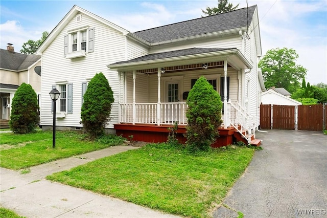 23 Lombardy St, Lancaster, NY 14086 - view of front of home with a porch and a shingled roof