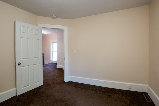 17 Orchard St, Canisteo, NY 14823 - empty room featuring dark carpet and baseboards
