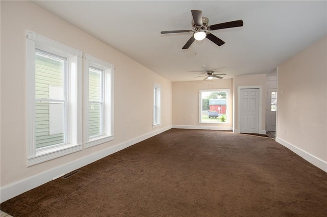 17 Orchard St, Canisteo, NY 14823 - empty room featuring dark carpet and a ceiling fan