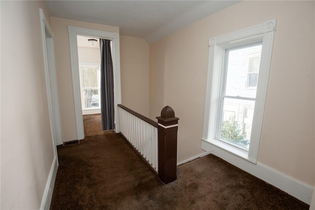17 Orchard St, Canisteo, NY 14823 - corridor with dark carpet and an upstairs landing