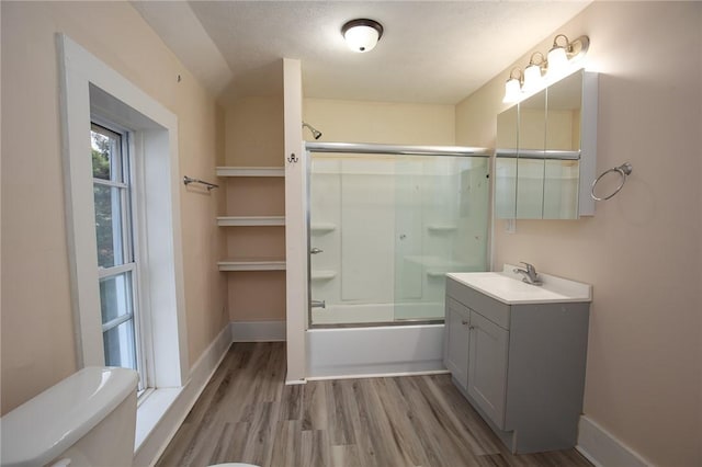 17 Orchard St, Canisteo, NY 14823 - full bath with vanity, wood finished floors, and combined bath / shower with glass door
