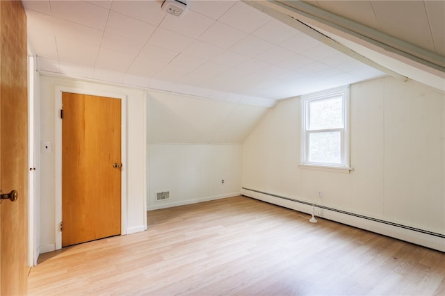 773 Marshall Rd, Chili, NY 14624 - bonus room featuring baseboard heating, light wood-style flooring, and vaulted ceiling