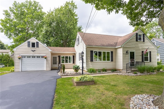773 Marshall Rd, Chili, NY 14624 - view of front facade with a shingled roof, driveway, an attached garage, and a front lawn