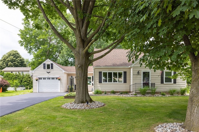773 Marshall Rd, Chili, NY 14624 - view of front of house with a garage, asphalt driveway, and a front lawn