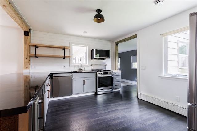 773 Marshall Rd, Chili, NY 14624 - kitchen featuring stainless steel appliances, a baseboard radiator, open shelves, dark wood-style flooring, and dark countertops