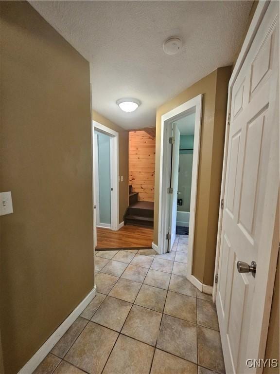 147 N St, Constantia, NY 13042 - corridor featuring light tile patterned floors and a textured ceiling