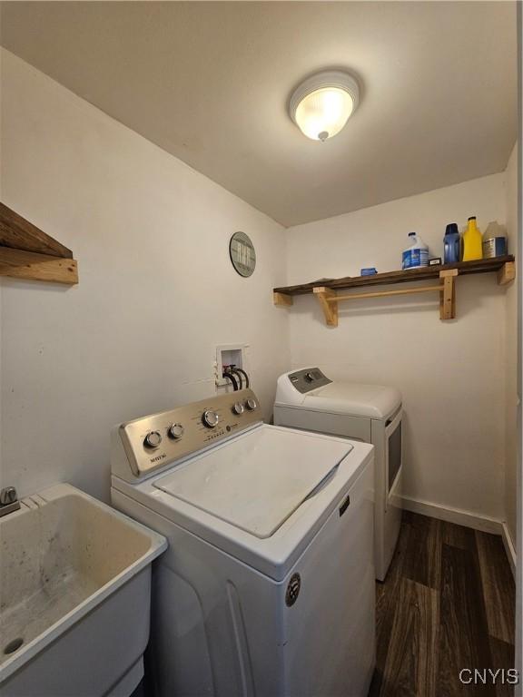 147 N St, Constantia, NY 13042 - laundry area with independent washer and dryer and dark wood-type flooring