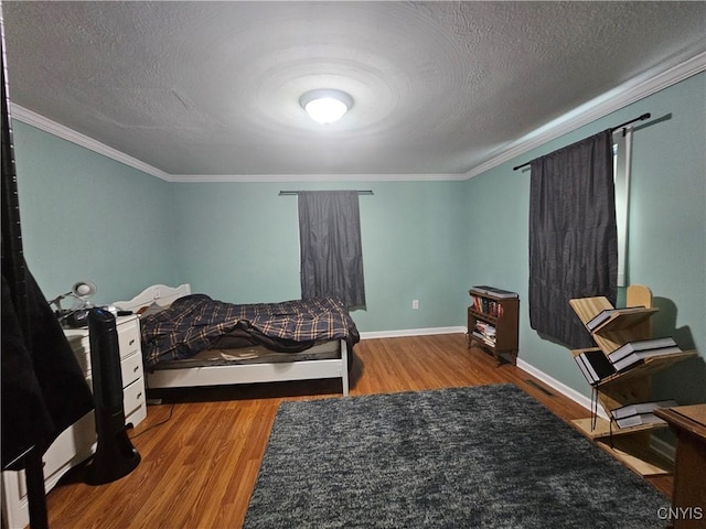 147 N St, Constantia, NY 13042 - bedroom featuring wood finished floors, crown molding, and a textured ceiling