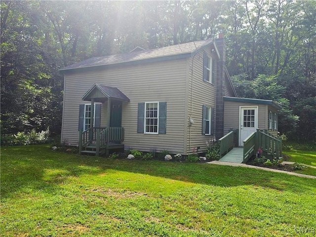 147 N St, Constantia, NY 13042 - view of front of house featuring a front lawn and a chimney