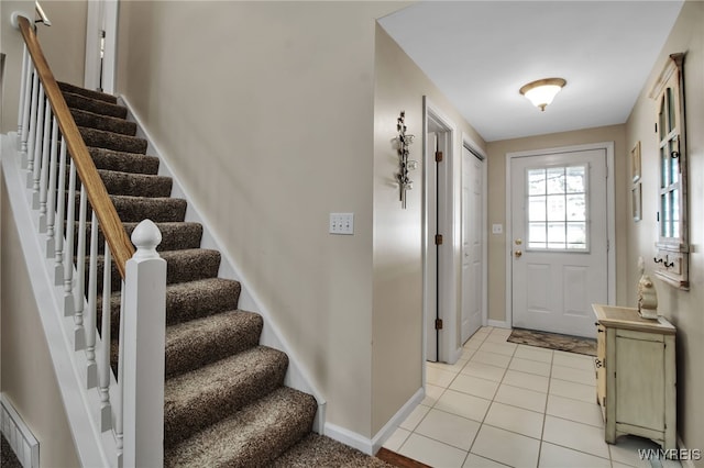 21 Towne Square Dr, Lancaster, NY 14086 - foyer entrance with stairway and light tile patterned flooring