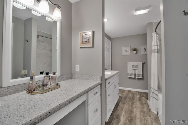 21 Towne Square Dr, Lancaster, NY 14086 - full bathroom featuring vanity, wood finished floors, and shower / bath combination with curtain