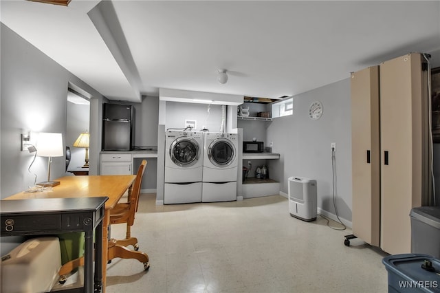 21 Towne Square Dr, Lancaster, NY 14086 - laundry room featuring washing machine and clothes dryer, light flooring, and a desk