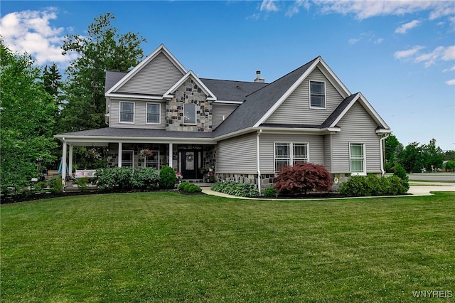 6132 Railroad St, Clarence, NY 14032 - view of front facade featuring a front yard, a shingled roof, and covered porch