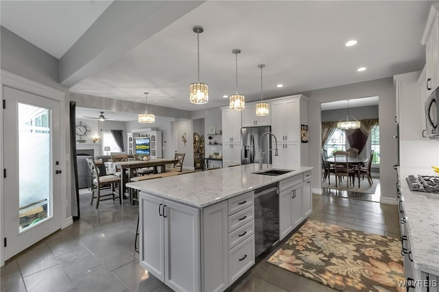 6132 Railroad St, Clarence, NY 14032 - kitchen featuring stainless steel appliances, white cabinetry, an island with sink, recessed lighting, and pendant lighting