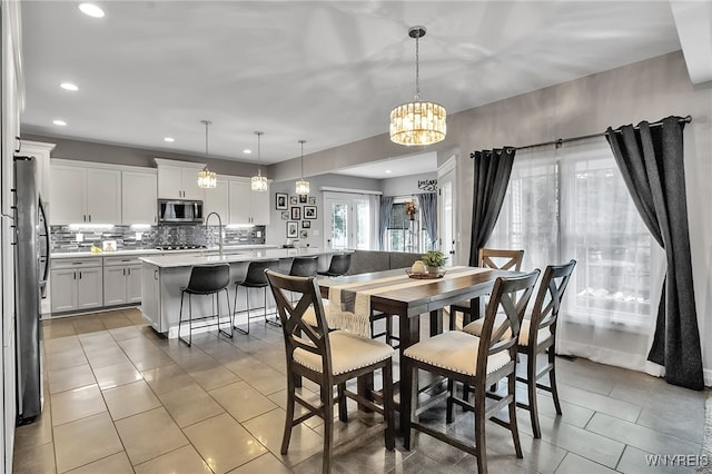 6132 Railroad St, Clarence, NY 14032 - dining area with light tile patterned floors, recessed lighting, and a chandelier