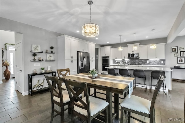 6132 Railroad St, Clarence, NY 14032 - dining room with recessed lighting and a chandelier
